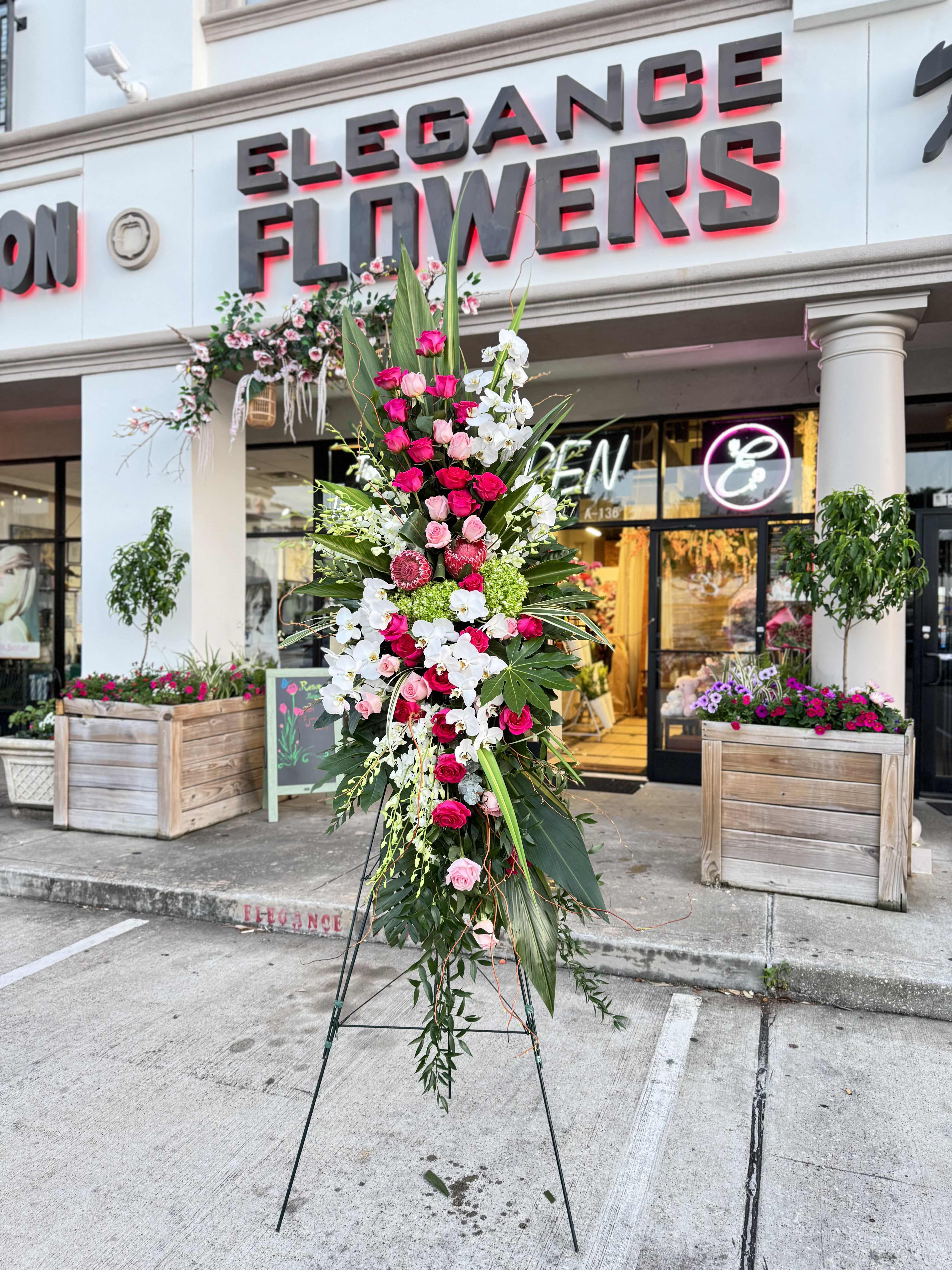 Easel #23 Online - A standings flower arrangement for a funeral service is a heartfelt tribute designed to honor and celebrate the life of the deceased. These arrangements are typically displayed on an easel or stand, making them highly visible and a central part of the memorial decor.