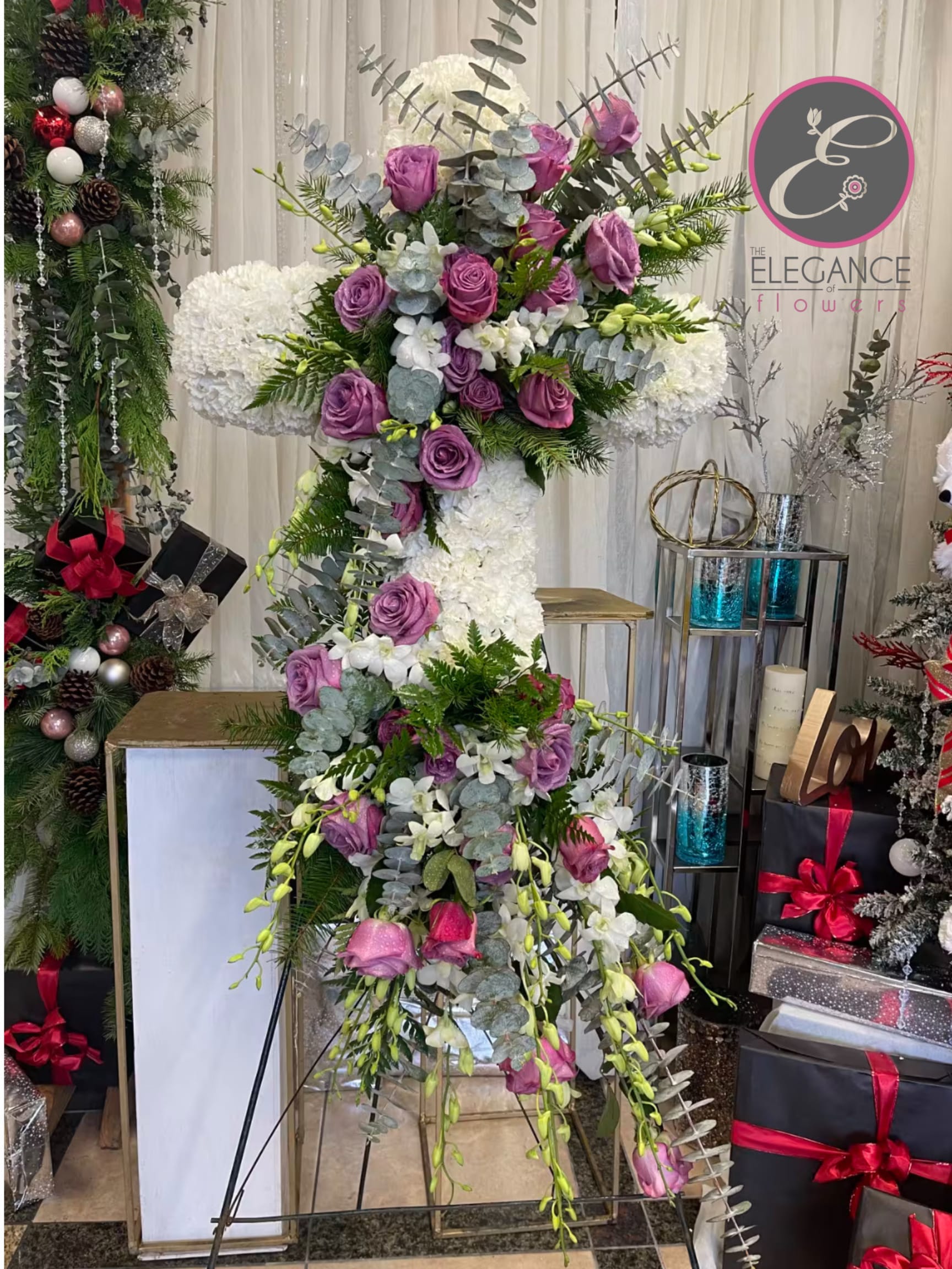 Cross Stand #6 - Cross stand for a funeral is a graceful tribute, symbolizing faith and remembrance. Adorned with fresh flowers, it stands as a comforting centerpiece during memorial services.