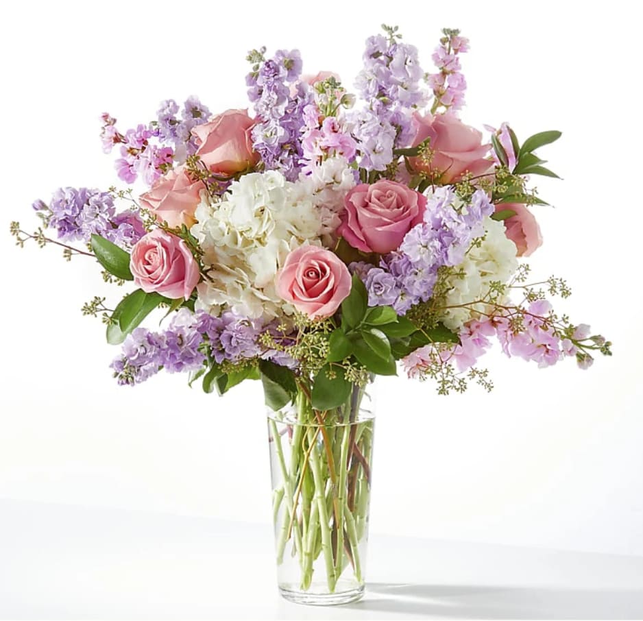 Morning Meadow - A soft, garden-style bouquet featuring blush and lavender tones with creamy whites and fresh greenery. The arrangement feels light and romantic, with a mix of focal blooms and delicate filler flowers creating a natural, airy look. Flowers may vary by season and could be substituted with similar blooms in matching colors and textures while keeping the same overall feel!