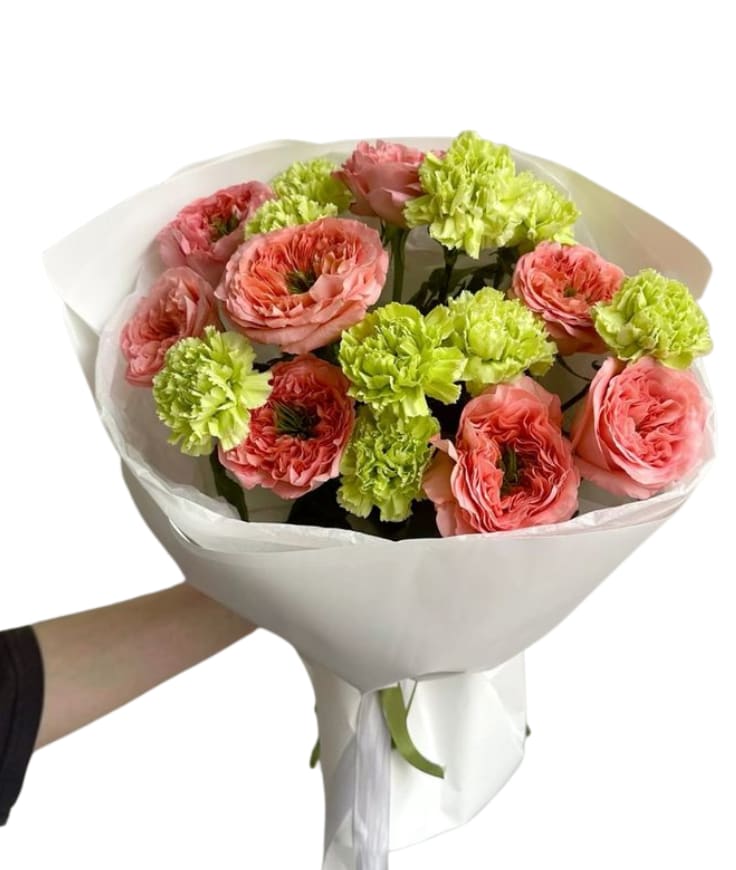 Spring Spritz - A bright, modern bouquet featuring coral garden-style roses paired with playful lime green blooms for a fresh, unexpected pop. Cheerful, stylish, and perfect for birthdays, congratulations, or anyone who loves something a little different. Includes: coral roses + lime green blooms (carnations or seasonal equivalent) Note: Exact flower varieties may vary, but the bold coral + green color vibe will stay the same.