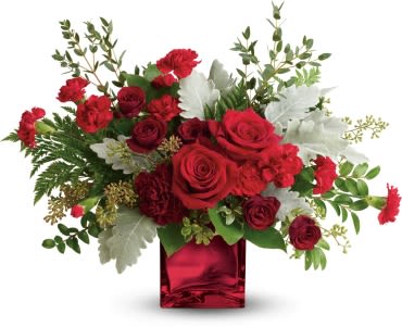 Isn't she lovely - A love mix of red flowers in a red cube with a mix of different Greens 