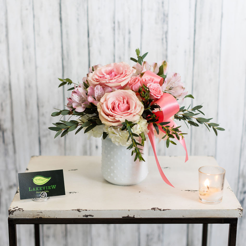 Belle - Simply sweet!  Celebrate with lush pink and white blooms adorned with a classic satin ribbon accent.  Approximate Dimensions: 9" H x 9" W