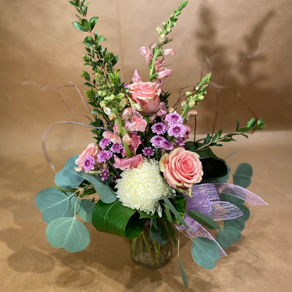 Delicate Love - A changing mix of light pink, lavender and white flowers to reflect the season.