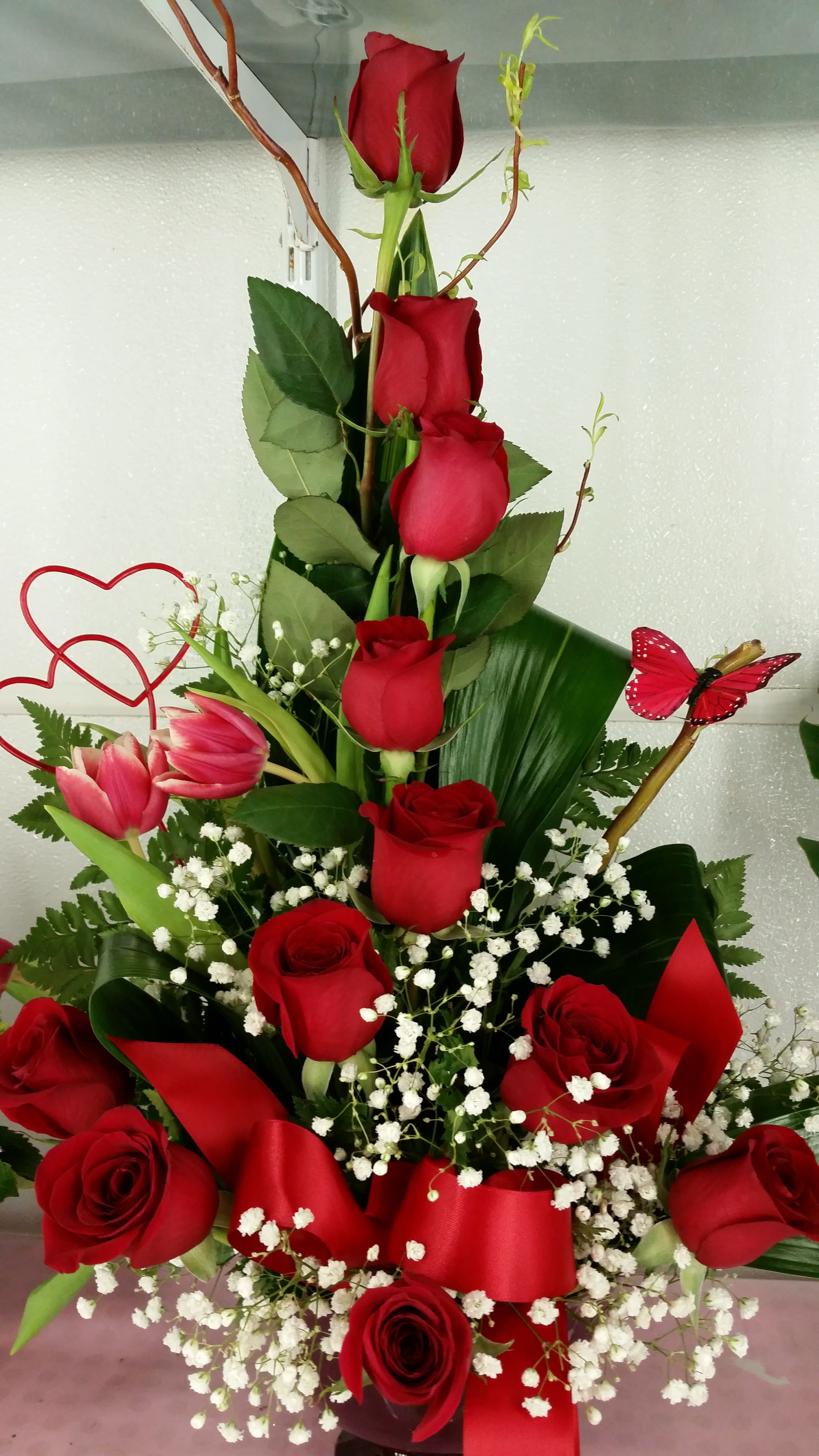 dozen roses in a basket - red roses, pink tulips and million star  with butterfly