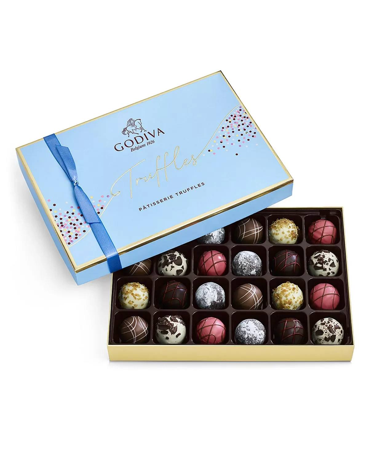 Godiva Patisserie Truffle Assortment (24pc) - Open this beautiful box tied with a blue ribbon and indulge in the luxurious taste of Godiva's Patisserie Truffle Assortment. This exquisite collection features twenty-four pieces of decadent truffles inspired by the world's finest desserts, each crafted to perfection.  Key Features:  Premium Quality: Made with the finest ingredients, Godiva's truffles are known for their smooth texture and exceptional flavor. Assorted Dessert Flavors: Enjoy beloved dessert flavors such as: Strawberry Crème Tarte Truffle: Strawberry purée and vanilla mousse in a white chocolate shell. Black Forest Cake Truffle: 72% cacao extra dark chocolate ganache infused with cherry brandy flavor. Chocolate Lava Cake Truffle: Dark chocolate ganache and liquid fondant in a dark chocolate shell, dusted with powdered sugar. Plus More: Additional satisfying dessert flavors to delight your palate. Elegant Presentation: Beautifully crafted and elegantly packaged, perfect for gifting or enjoying as a special treat. Perfect for Any Occasion: Ideal for birthdays, anniversaries, holidays, or simply to indulge your chocolate cravings. Twenty-Four Pieces: Ensures a satisfying and memorable chocolate experience.  Treat yourself or someone special to the luxurious taste of Godiva's Patisserie Truffle Assortment. Each truffle reflects Godiva's dedication to quality and craftsmanship, providing an unforgettable indulgence.  