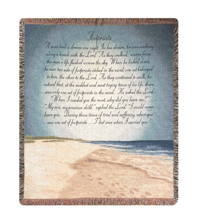 Footprints In The Sand Afghan - Woven afghan measures approximately 50in x 60in and displays the text "A man had a dream one night. In his dream, he was walking along a beach with the Lord. As they walked, scenes from the man's life flashed across the sky. When he looked down, he saw two sets of footprints etched in the sand; one set belonged to him, the other to the Lord. As they continued to walk, he noticed that, at the saddest and most trying times of his life, there was only one set of footprints in the sand. He asked the Lord 'When I needed you most, why did you leave me?' 'My son, my precious child,' replied the Lord. 'I would never leave you. During those times of trial and suffering, when you saw one set of footprints,...that was when I carried you'"