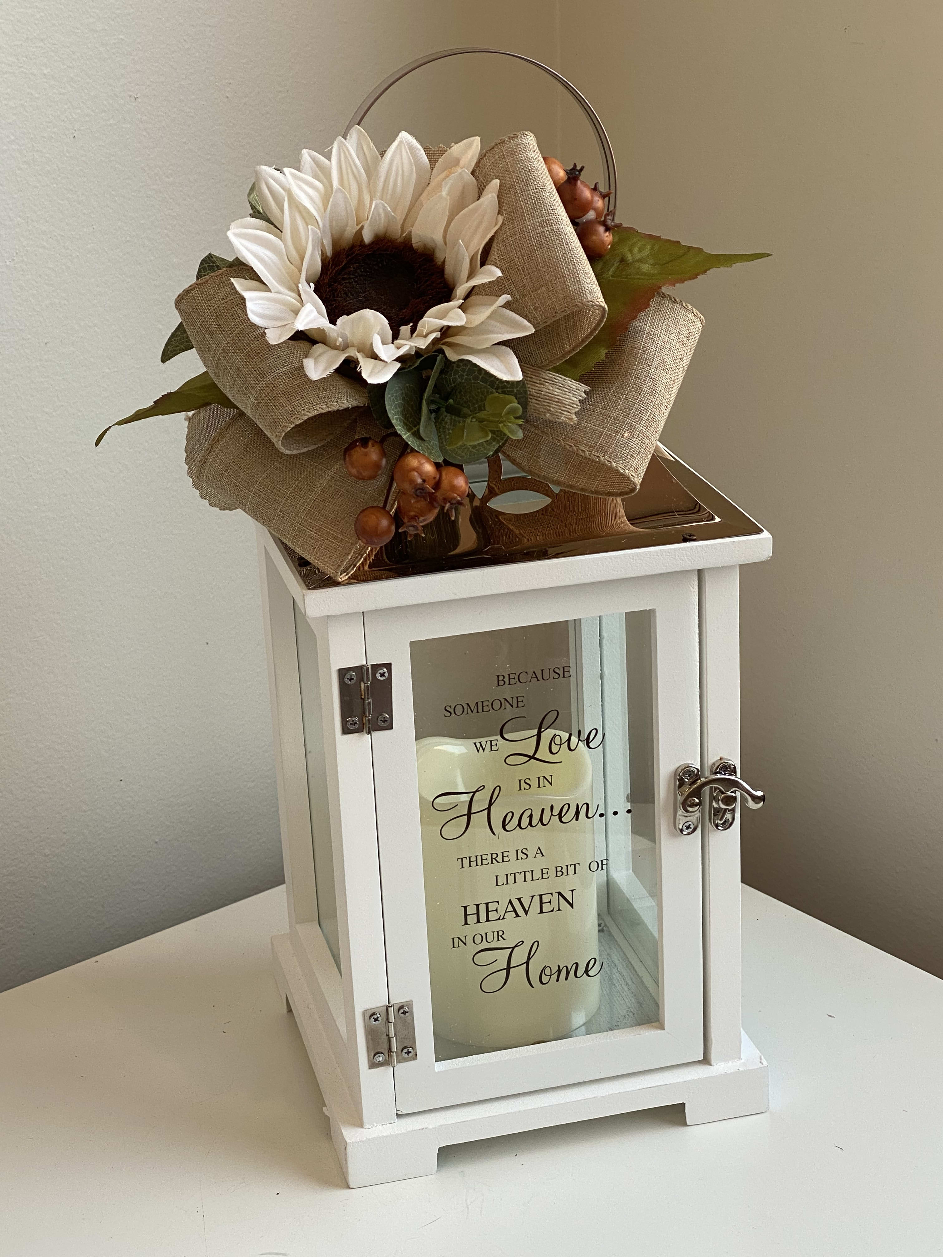 SYM 15 - White Memorial Lantern with Copper Top with Faux Accents.  Lantern says "Because someone we love is in Heaven...There is a little bit of Heaven in our Home."  Includes LED candle.
