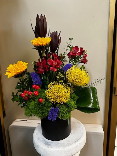 Safari Sunset - Sunflowers, pincushion protea, alstroemeria, leucadendron, hypericum, ti leaves