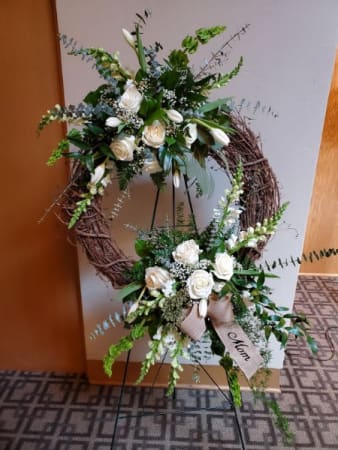 Eternal Elegance Wreath - All white flowers grace this grapevine wreath with greens flowing through in a unique design. 