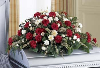 Sweet Sincerity Casket Spray - Your sincere wishes of sympathy are conveyed with red and white carnations against a lush background of greens in this casket spray. Other colors are available upon request.