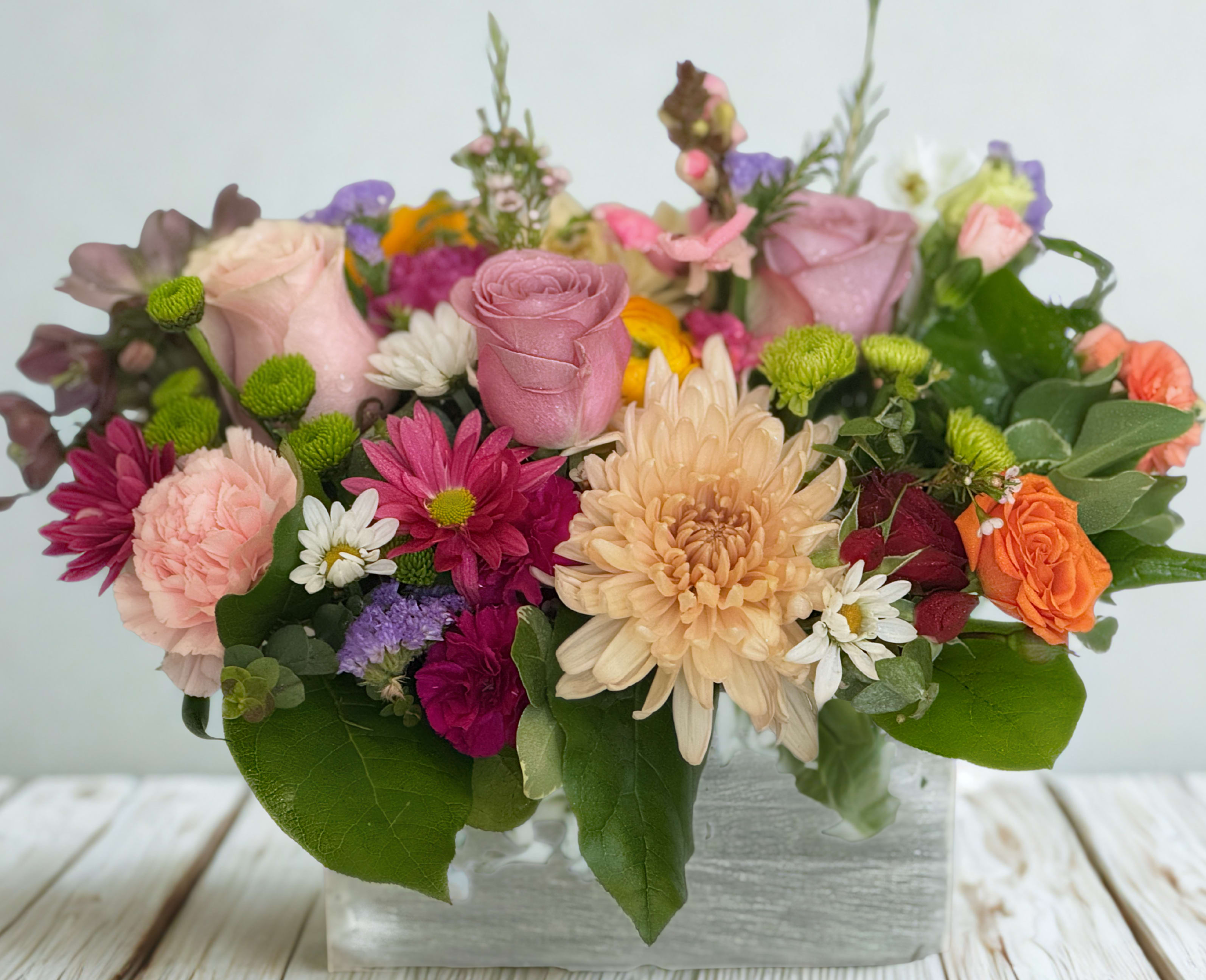 Pastel Pop Parade - Pastel Pop Parade is a cheerful blend of soft pastels and rich jewel tones, designed to feel both graceful and energetic. This charming arrangement brings whimsy and color to any space with its playful mix of textures and hues.