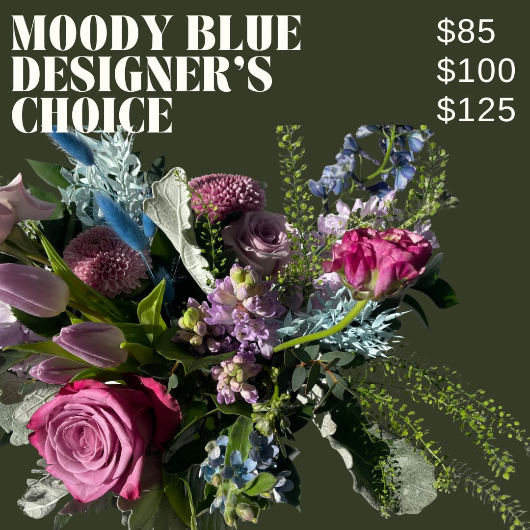 Moody Blue Designer's Choice - Allow our designers to choose our freshest cool toned blooms! Arranged in a clear glass vase. Flower types and color will vary!  *IMAGE SHOWN IS AN EXAMPLE AND WILL NOT BE REPLICATED*