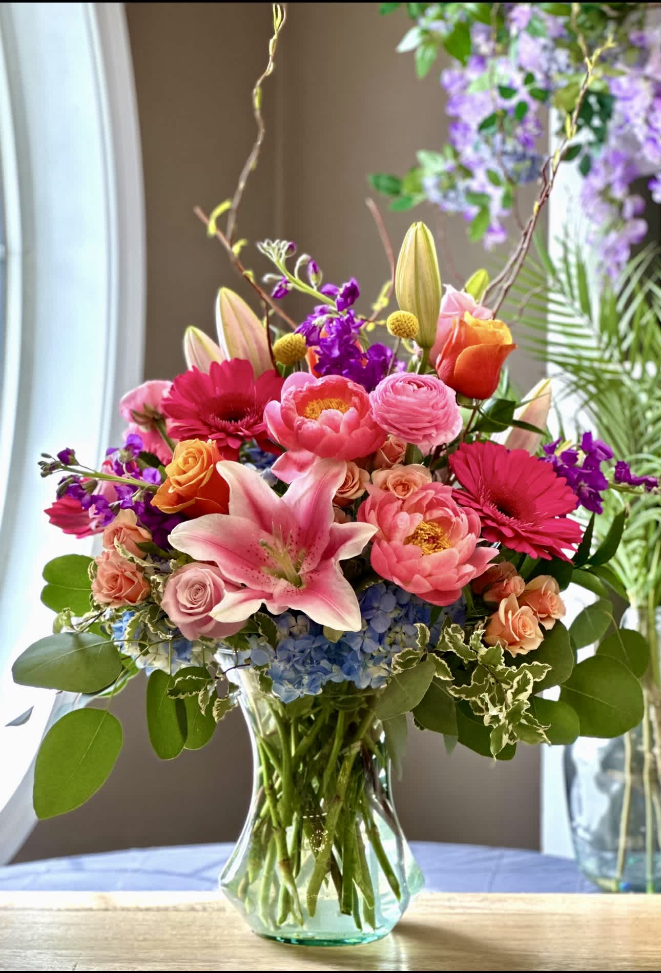 Garden Splendor Bouquet - MOTHER'S DAY COLLECTION | LOCAL DELIVERY ONLY  Go all out with "Garden Splendor" - the showstopper of our Mother's Day Collection. Designed in a grand vase, this arrangement is overflowing with hydrangea, peonies, stock, gerbera daisies, roses, lilies, billy balls, curly willow and premium greenery. For the mom who goes above &amp; beyond, this is your moment to wow her!