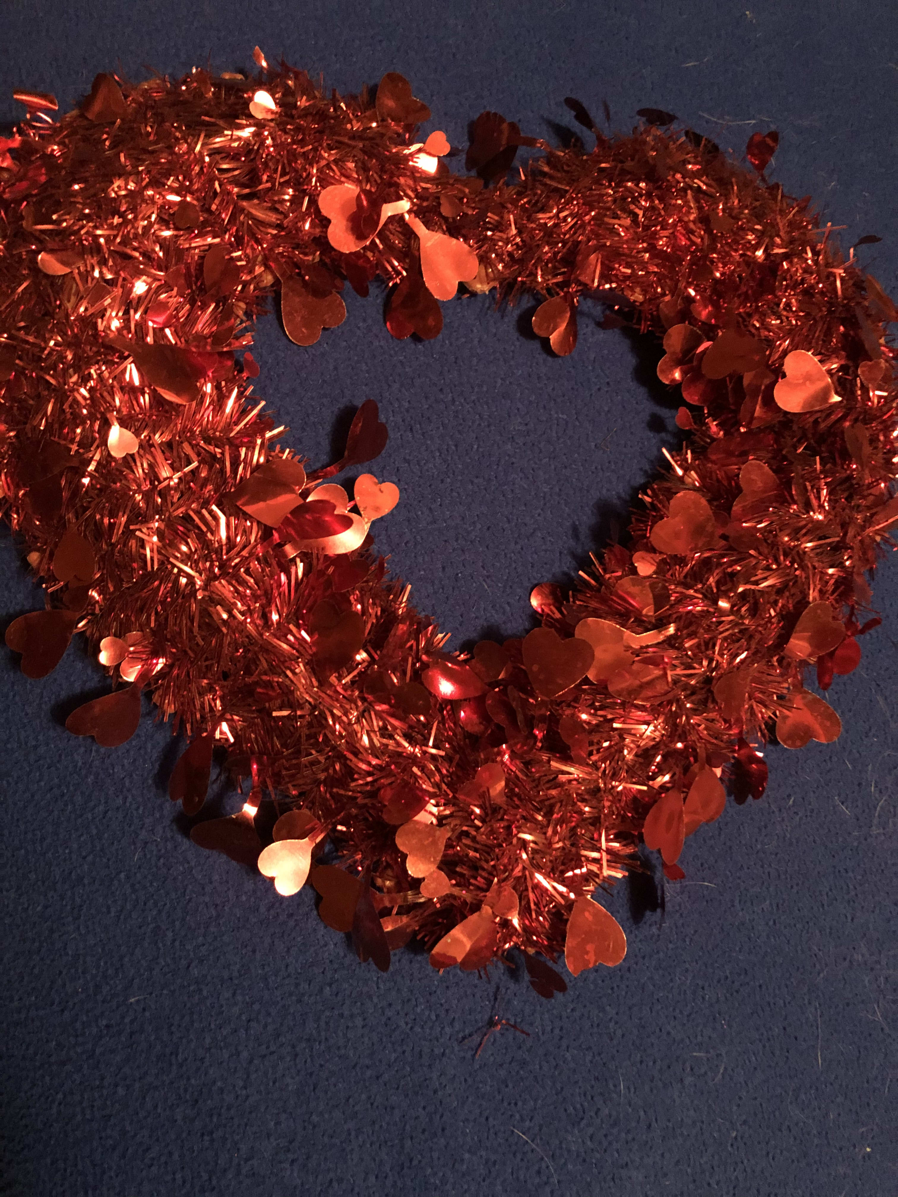 Heartstrings - One of a kind Heartstrings is lovely showpiece of affection. Can be displayed in a window, hung on a wall or used as an accent to surround your floral arrangement.  (another idea is to place on a table and have a small box in the middle) hint, hint. ;)