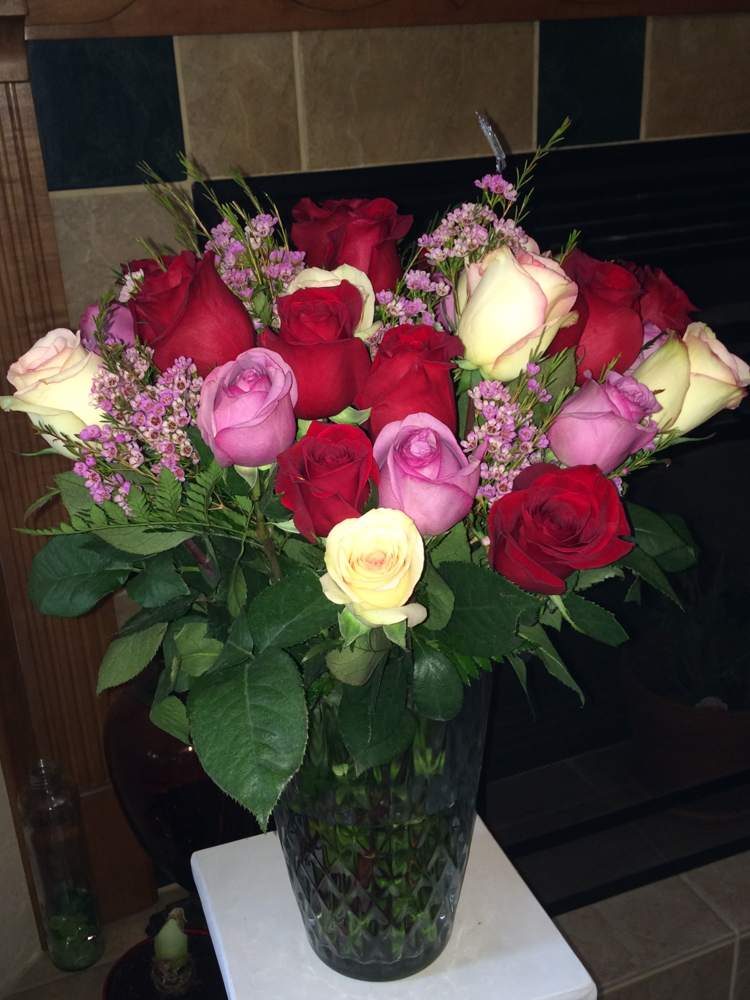 Roses Explosion - 3 Dozen premium multi-colored roses. Approximately 50% Red, 50% multi-colored. Delivered in a clear designer vase. (Vase shown is for illustration purpose)  Substitution Policy In some instances, the florists photo may represent an overall theme or look and include a one-of-a-kind vase which cannot be exactly replicated. Although the actual bouquet may not precisely match the photo, its temperament will. Occasionally, substitutions of flowers or containers happen due to weather, seasonality and market conditions which may affect availability. If this is the case with the gift you've selected, the local florist will ensure that the style, theme and color scheme of your arrangement is preserved and will only substitute items of equal or higher value.