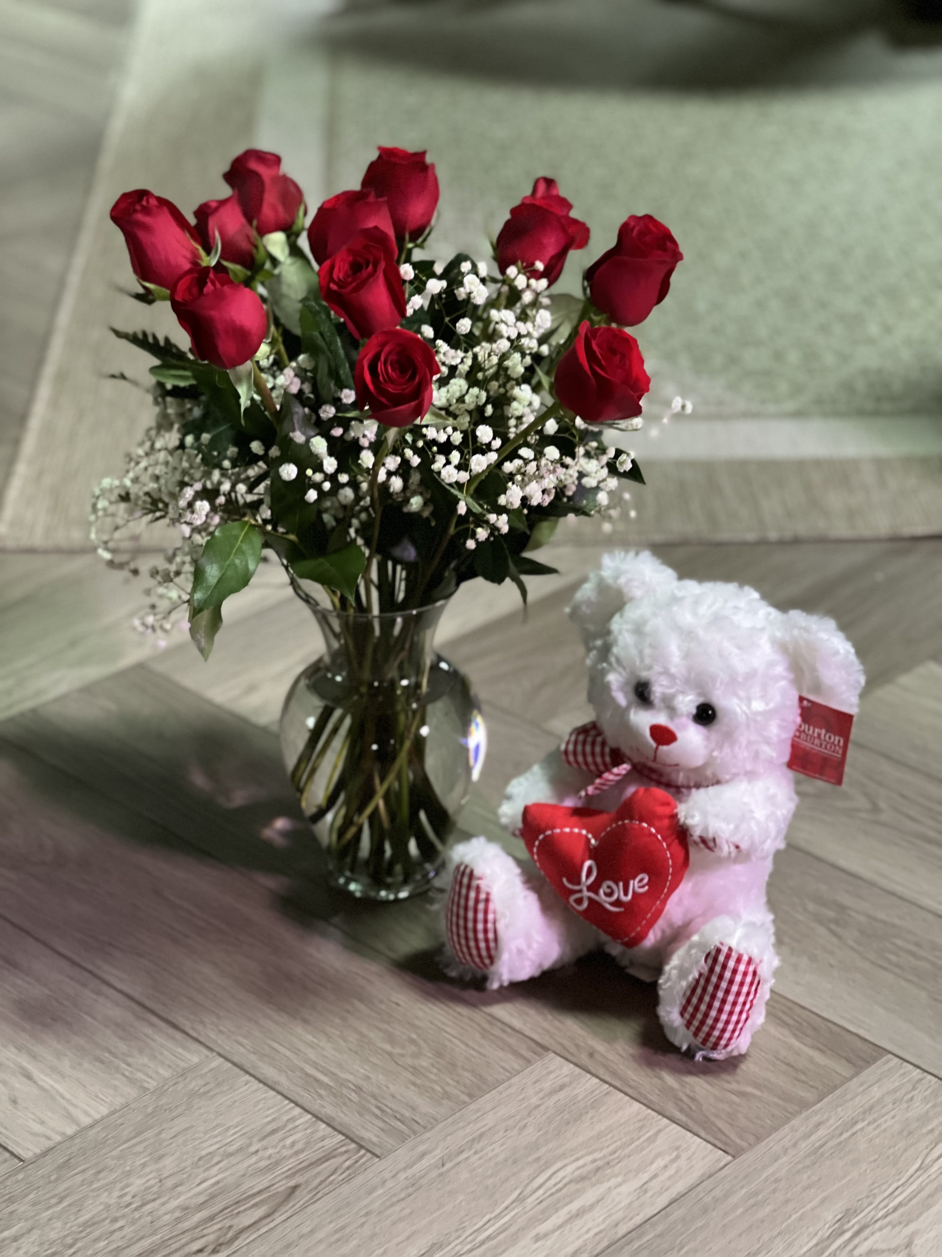 Ultimate Valentine's Day Gifts - Enter the world of bundling, our standard comes with a 10" Teddy Bear and 1 dozen roses in a clear vase with baby's breath and greenery. Our Deluxe comes with the roses in clear glass vase with the 10" Teddy Bear and the addition of a 1 oz. homemade lavender lotion hand cream. 