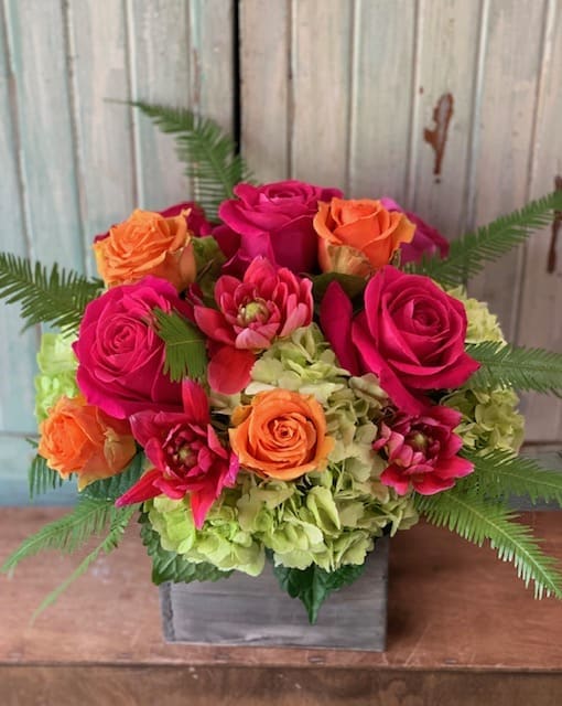 Cheerful Box - Grey wash wood box filled with cheerful mix of green hydrangea, hot pink and orange roses. dahalias &amp; tree fern will brighten anyones day.