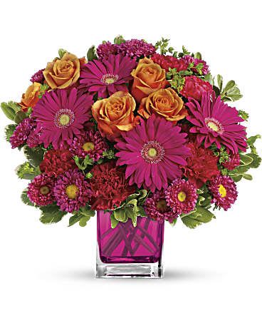 Turn Up The Pink Bouquet - Pop goes the pink! A gorgeously chic gift for any occasion, this perky pink and orange bouquet is pure fun, especially when it''s hand-delivered in our fabulous fuchsia Cube! This brilliant bouquet of lush orange roses, hot pink gerberas, carnations and matsumoto asters are accented with bupleurum and variegated pittosporum. Delivered in a glass Cube. Approximately 11" W x 11" H This item is hand-arranged and delivered by our florist. All prices in U.S. Dollars.