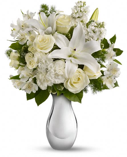 Shimmering White Bouquet - So simple, and so breathtakingly beautiful. This lovely flower arrangement features an all-white bouquet of roses, lilies and more in an exquisite silver reflections vase that will be cherished for years.  Perfect for anniversaries, birthdays - or just because. The gorgeous bouquet includes white roses, white spray roses, white oriental lilies, white alstroemeria and white stock accented with assorted greenery. Approximately 16" W x 18 1/2" H This item is hand-arranged and delivered by our florist. All prices in U.S. Dollars.