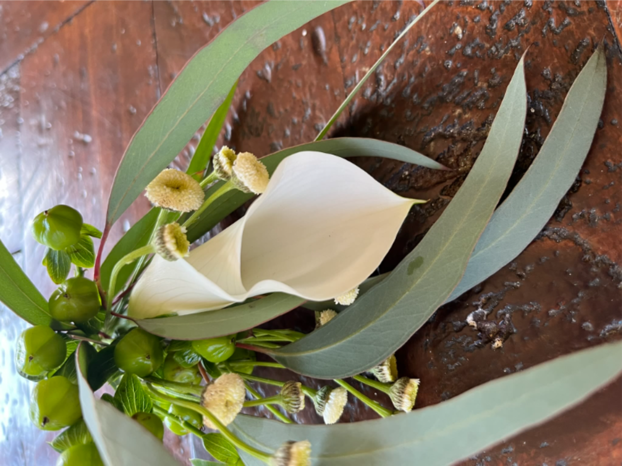 Wedding Essential - A classic white boutonniere designed to complement formal attire with effortless elegance.