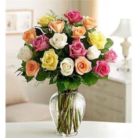 18 Mixed Colored Roses in Vase - Our premium 18 long stem mixed colored roses are an elegant surprise for the one you can trust, the one you can turn to, the one you love with all your heart. Beautifully arranged by our expert florists with lush greenery inside a classic glass vase, 18 radiant blooms are hand-delivered and ready to delight them for any romantic reason.