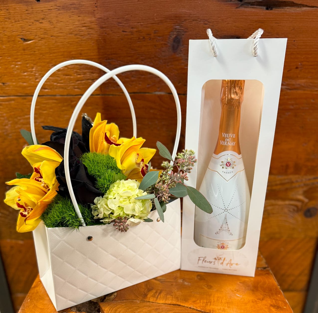 Throw It In The Bag - Choose a designer's choice arrangement and throw it in the bag. Starting at $99.99 (Champagne Value at $20)
