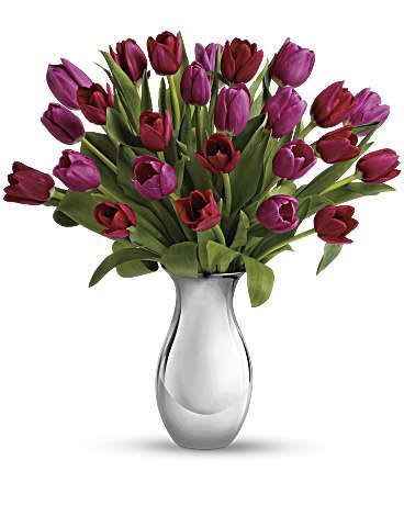 Sweet Surrender Bouquet - Surrender to the elegant, natural beauty of tulips. Over a dozen red and pink flowers are presented in our graceful Silver Reflections vase. It''s an understated presentation that highlights the tulips'' natural beauty - as well as your love and friendship. This gorgeous bouquet includes seven red tulips and eight pink tulips. This bouquet is delivered in our exclusive Silver Reflections vase, a metalized ceramic vase with a light pink tone. Approximately 13" W x 16" H This item is hand-arranged and delivered by our florist. All prices in U.S. Dollars.