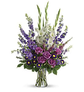 Joyful Memory Bouquet - Lavender and white sympathy flowers make a grand statement in this joyful bouquet. Cherish your memories with this lasting remembrance of lavender larkspur and roses, deep purple asters, pure white gladioli and the softest pink heather. A classic assortment of flowers such as lavender larkspur, stock and roses, plus purple asters, white gladioli and pink heather. Approximately 22 1/2" W x 32" H