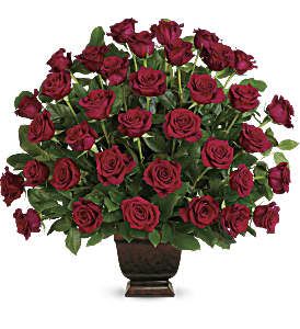 Rose Tribute - As true as the love symbolized by a red, red rose are the heartfelt memories and deep feelings embraced with this classic and elegant expression of tribute. Two dozen red roses, accented by salal, are presented in an exclusive Noble Heritage Urn. Approximately 30" W x 27 1/2" H