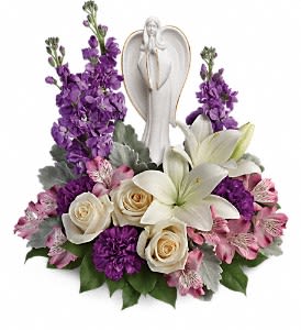Teleflora's Beautiful Heart Bouquet DX - Show them they're in your heart with this magnificent display of roses, lilies and alstroemeria, gracefully surrounding a timeless angel sculpture keepsake. Beautifully fragrant, it's a tribute that will warm their hearts forever. This beautiful arrangement includes crème roses, white asiatic lilies, lavender alstroemeria, purple carnations, lavender stock, dusty miller and lemon leaf. Delivered with Teleflora's Angel of Grace keepsake. Orientation: One-Sided