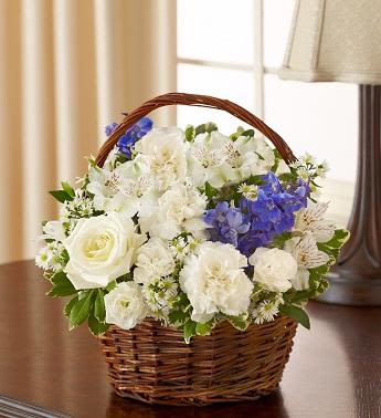 Peace, Prayers &amp; Blessings - Blue and White - Offer peace and comforting prayers during times of loss with this elegant blue and white basket arrangement. A pair of graceful doves sits atop a gathering of fresh roses, delphinium, alstroemeria and carnations, beautifully hand-designed by our florists. Please note: doves are available in select areas only. Check with your local florist.  Graceful blue and white arrangement of roses, delphinium, alstroemeria, carnations, mini carnations and monte casino, accented with variegated pittosporum and myrtle Hand-arranged in a willow handled basket with a pair of peaceful white dove picks; basket measures 8"H Appropriate to send to the home of friends and family members or to the memorial service Large arrangement measures approximately 12"H x 12"L Medium arrangement measures approximately 11"H x 11"L Small arrangement measures approximately 10"H X 10"L Our florists hand-design each arrangement, so colors, varieties, and basket may vary due to local availability Lilies may arrive in bud form and will open to full beauty over the next 2-3 days