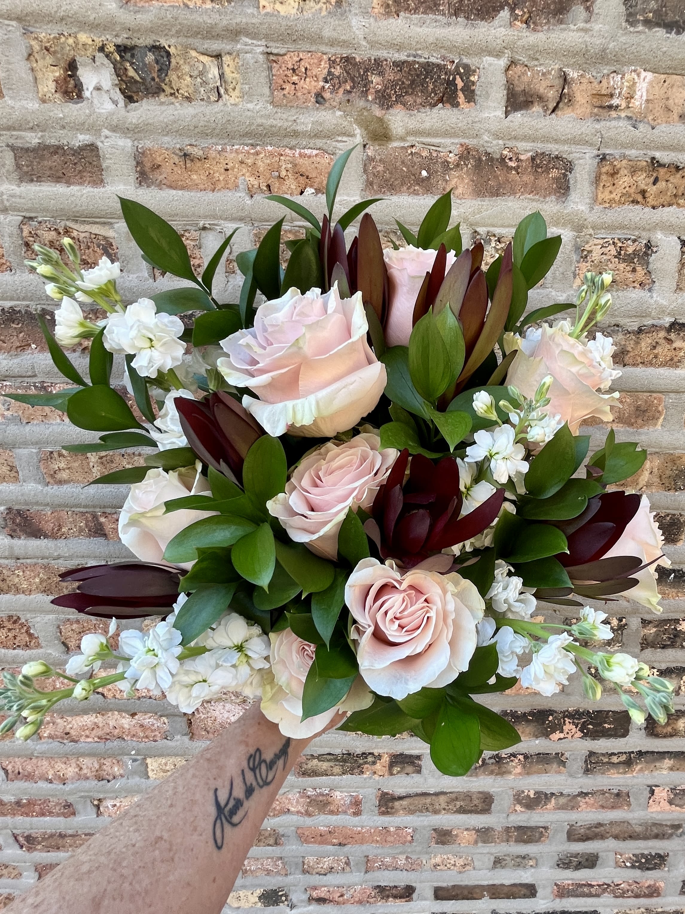 Modern Romance -Hand Tied 360 Bouquet  - Hand Tied 360 Bouquet (no vase) beautifully wrapped in tissue and paper with a bow.  One of our most popular Anniversary Flowers.