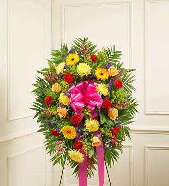 Deepest Sympathies Standing Spray - Bright - This Sympathy Standing Spray, crafted using elegant bright blooms, is a beautiful symbol of your sympathy and support.  Bright arrangement of peach and hot pink roses, lilies, Gerbera daisies, mums, snapdragons, alstroemeria, carnations and more An appropriate gift for family, friends and business associates to send directly to the funeral home Our florists use only the freshest flowers available so colors and varieties may vary Large measures approximately 56"H x 42"L without easel Medium measures approximately 46"H x 38"L without easel Small measures approximately 42"H x 32"L without easel