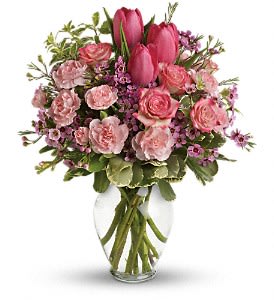 Full Of Love Bouquet - Spring into pink! Delicate roses, tulips and carnations fill a graceful vase with a cheerful expression of your love. It's affection perfection!  Includes pink roses, tulips, carnations and waxflower, accented with fresh pitta negra and variegated pittosporum. Delivered in a lovely glass vase.  Approximately 12" W x 14 1/2" H  Orientation: One-Sided