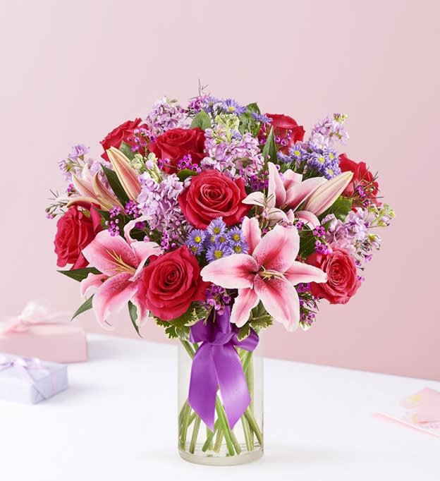 Straight from the heart - A gift means so much more when it comes from the heart. Our bouquet delivers on that sentiment, with radiant pink and purple blooms arranged in a glass vase. Finished with a purple satin ribbon, it’s a surprise that speaks volumes about how you feel.