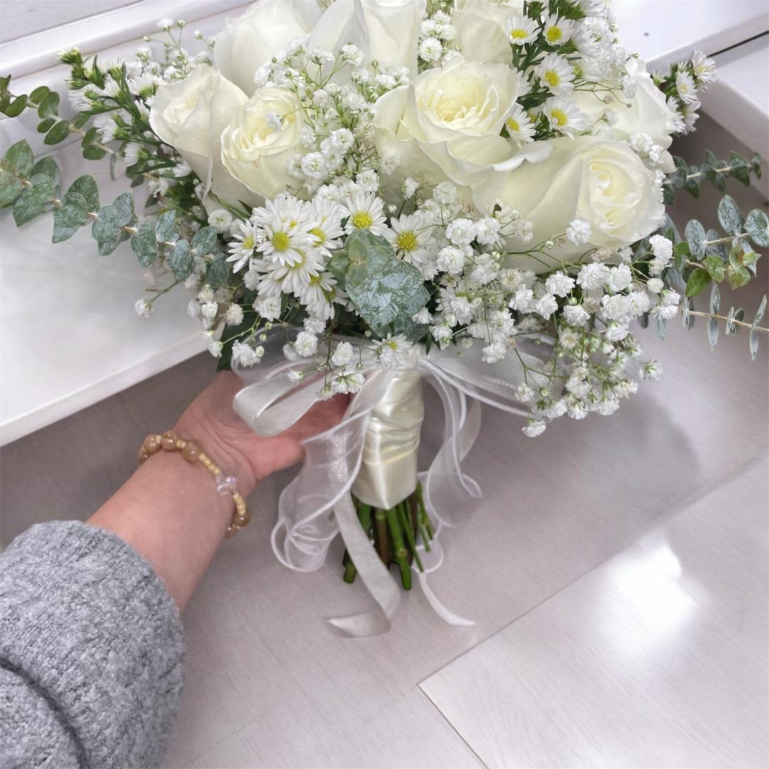 Bridal Sweet White 12 - Substitution Policy  Photos show the overall style and theme of each arrangement. Some flowers or vases may vary due to seasonality, weather, or availability. If substitutions are necessary, we will maintain the design’s style, color palette, and value.  Please note any important design preferences in the florist instructions at checkout or contact us to confirm availability.  Flower Care &amp; Guarantee  We guarantee flower freshness for 24 hours after leaving our shop.  Care Tips:  Cut flowers: Trim stems and change water every 2–3 days.  Foam arrangements: Add about 1 cup of water every couple of days.  After 24 hours, proper care is the customer’s responsibility.