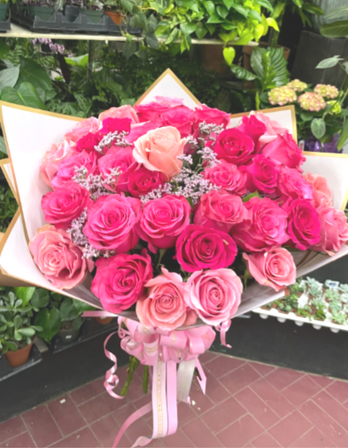 Cotton Candy Kiss - Soft, elegant, and full of charm — Blush &amp; Bloom is a graceful bouquet of 30 long-stem pink roses in varying shades, arranged to perfection and wrapped in soft blush paper with a delicate pink ribbon. These romantic blooms express admiration, gratitude, and sweetness, making this the perfect gift for birthdays, anniversaries, or simply to brighten someone's day with love and elegance.