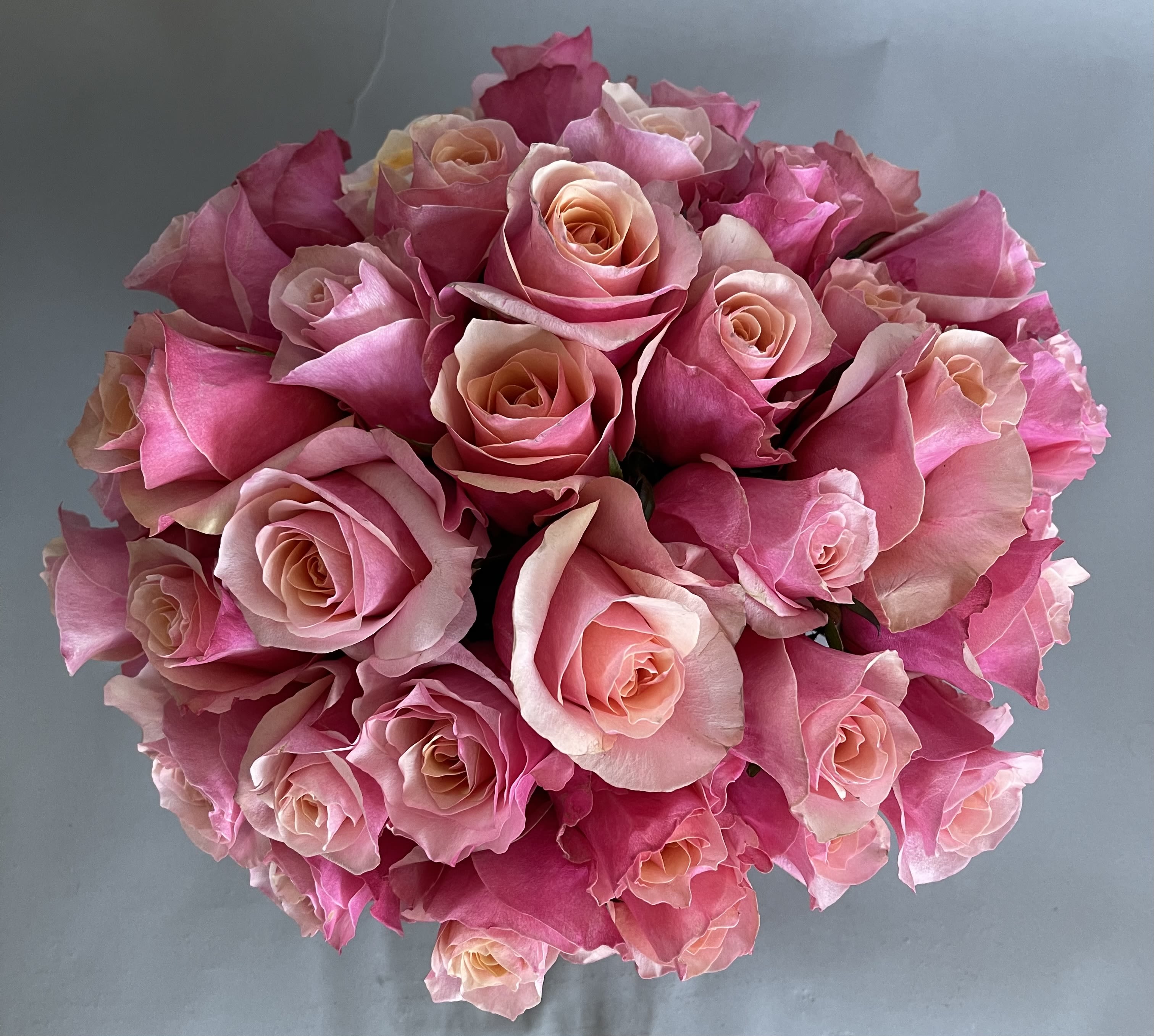Pretty and Pink for your love. - 30 stems of flamingo pink roses and a rose gold or silver cylinder. 