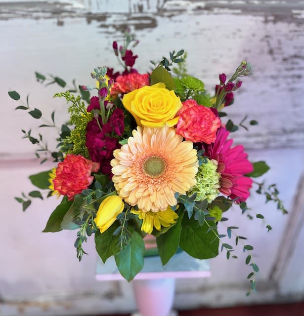 Carnival - A low profile, glass container filled with vibrant, happy colors! Carnival is suitable for any occasion and will be sure to brighten their day!