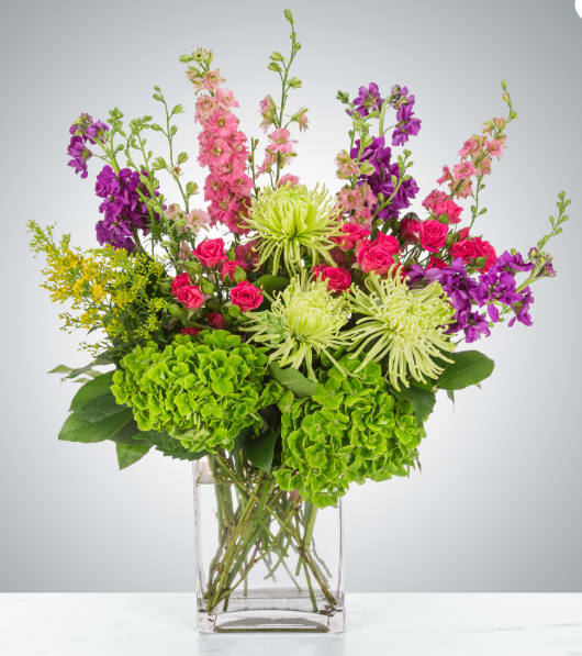 Sparklers  - A lively mix of larkspur, spider mums, spray roses, and hydrangea, this arrangement delivers a bright pop of color—perfect for birthdays, congratulations, and more.  Approximate Dimensions: 15"D x 18"H