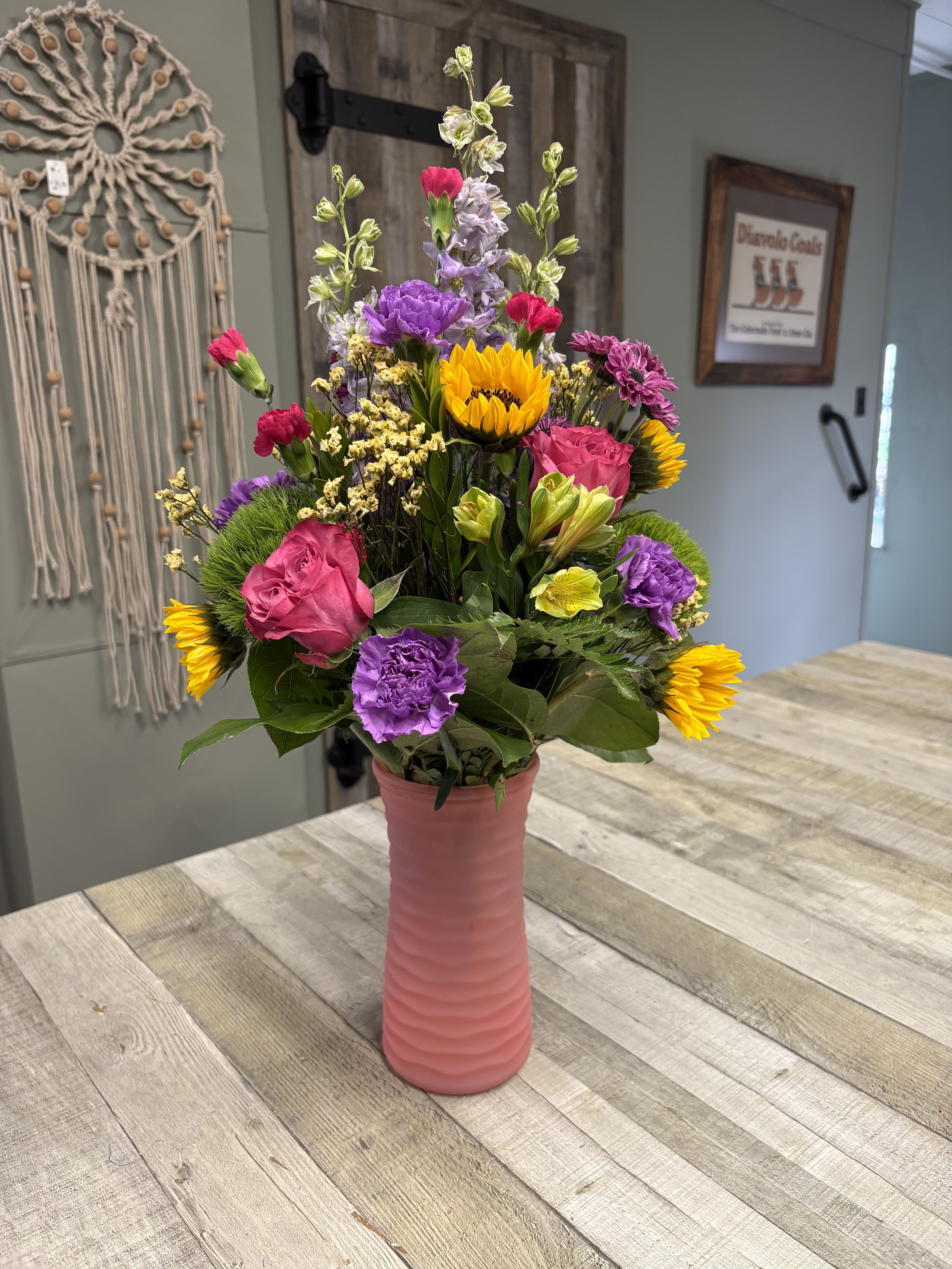 Isn’t She Lovely - The perfect floral gift for the awesome woman in your life. A mixed arrangement of the freshest blooms in designer’s choice of colors in a frosted pink vase.  