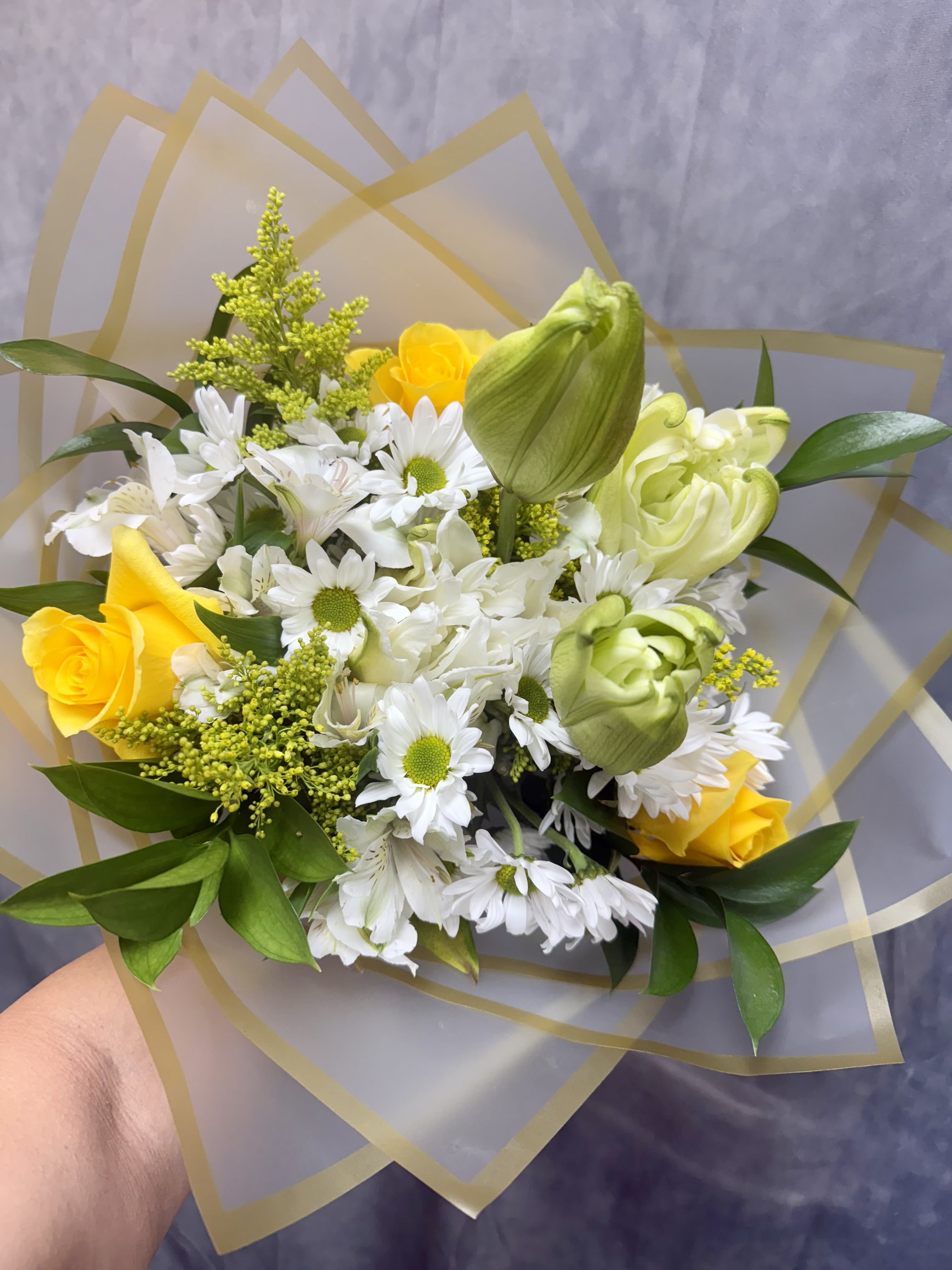 White Yellow Bouquet  - introducing Our New Design White Yellow hand tied bouquet, beautifully arranged with , white lilies, yellow roses fillers and greenery.  It doesn't come with a vase. 