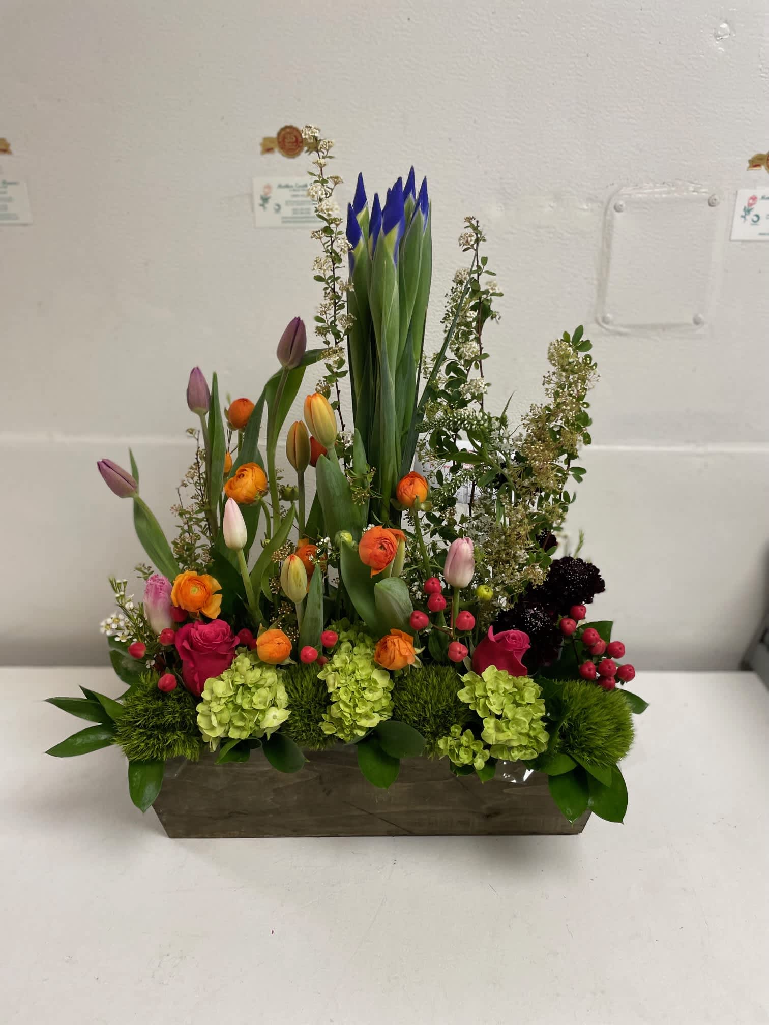 Hello welcome spring  - large box overflowing with tulips, iris , roses, hydrangea and more  