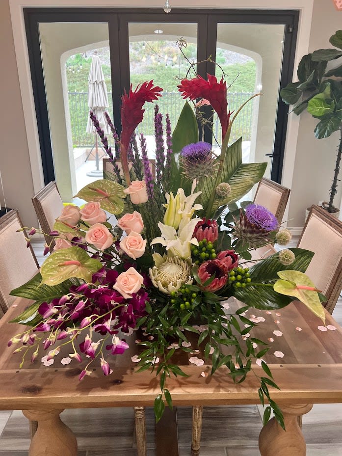 Lost in Paradise  - red ginger, pink roses, green anthurium, purple orchids, proteas, tropical leaves, liatris, some flowers might not be available all year round but we will do our best to make it as close as possible