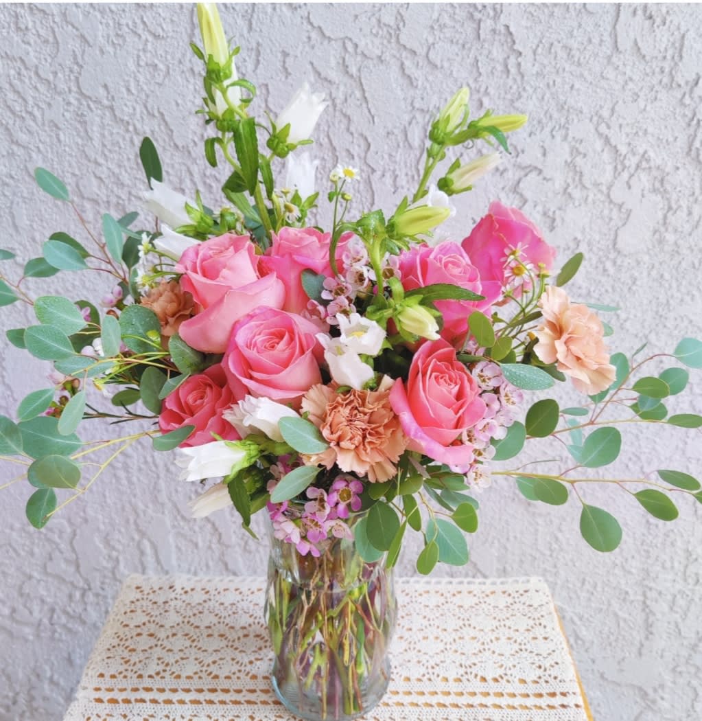 "Sophie "  Seasonal Arrangement  - Sophie, one of the most popular floral arrangements for a special moment. Beautiful Floral Arrangement created with premium seasonal flowers. Tones:  pink, peach, green and white tones. It's accented with fragant silver Dollar  eucalyptus . Garden style  Medium size Share Joy Share flowers 