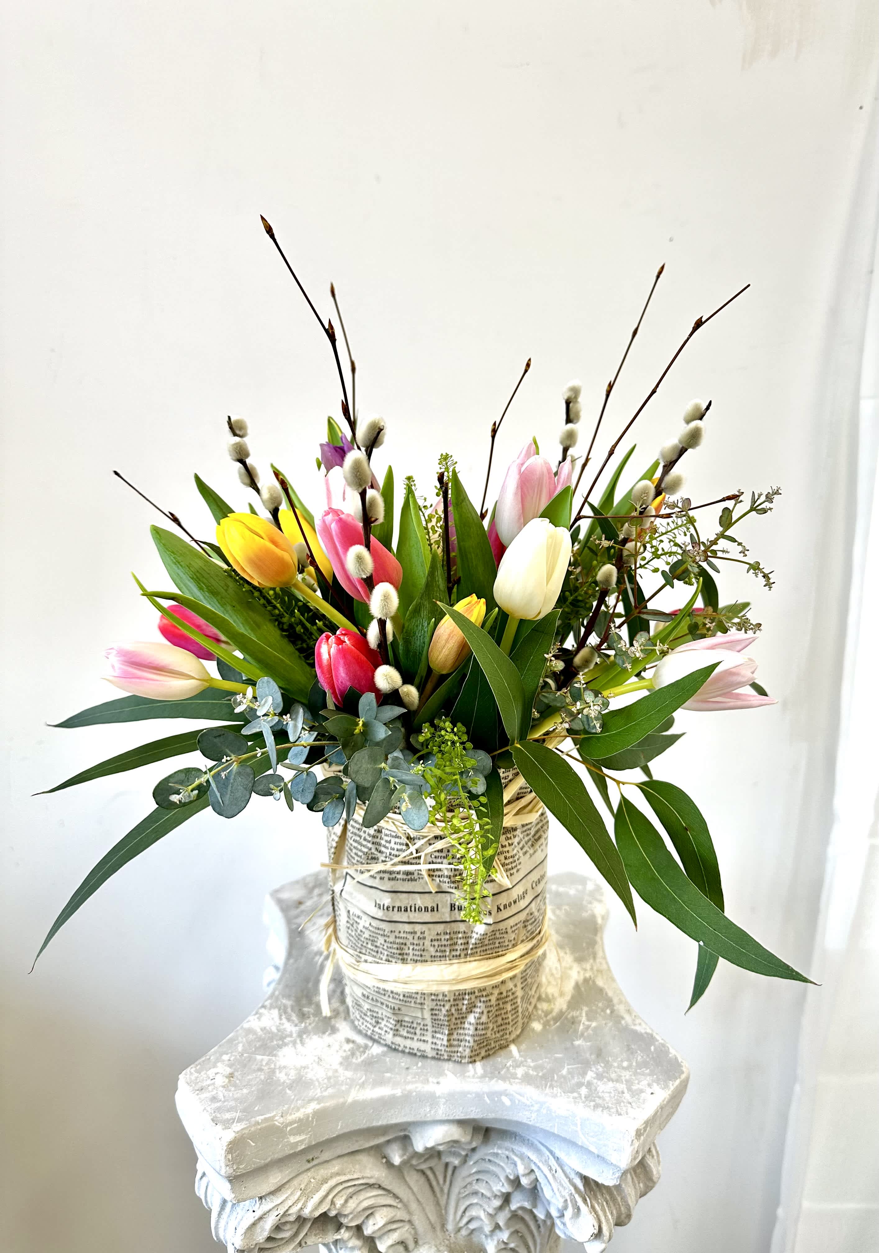 Spring Tulips by Westford Florist Art by Veny - Spring has sprung and we've got the perfect treat for your eyes and nose! Westford Florist Art by Veny Spring Tulips vase arrangement is a stunning display of carefully selected, expertly arranged tulips that will add a pop of color and sophistication to any living space. With meticulous attention to detail and love poured into every petal, this one-of-a-kind bouquet is truly a work of art. From birthdays to anniversaries or just because, our Spring Tulips make the perfect gift for any occasion. Sourced from top-notch growers worldwide, these tulips are guaranteed to impress even the most discerning individuals. Treat yourself or a loved one to the beauty of nature with our exquisite Spring Tulips from Westford Florist. Order now and let us bring the essence of spring indoors with our luxurious bouquet.  
