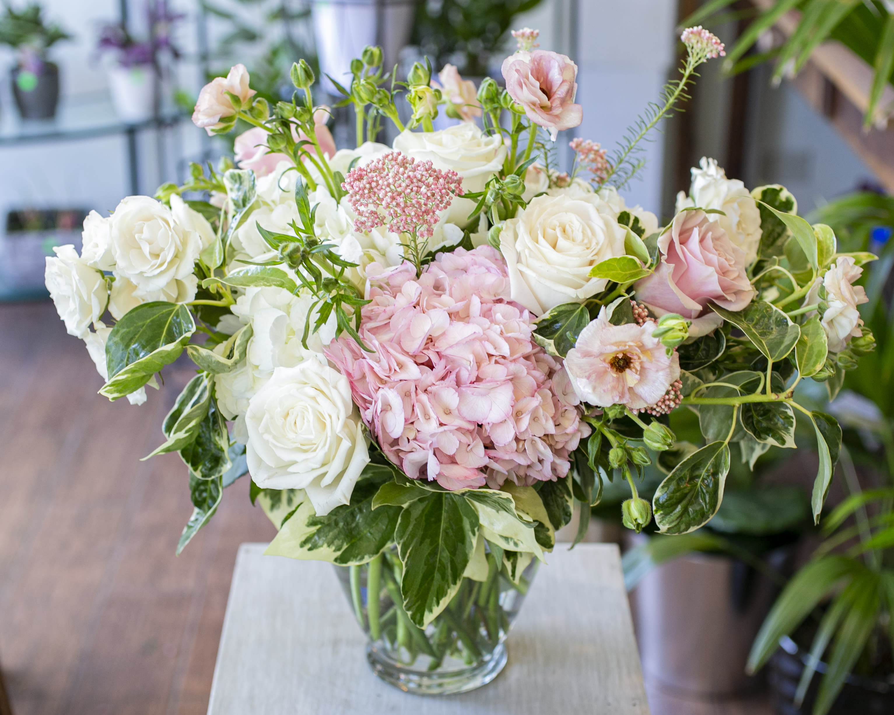 Diana - Elegant pink and white blooms arranged in a clear glass vase. 