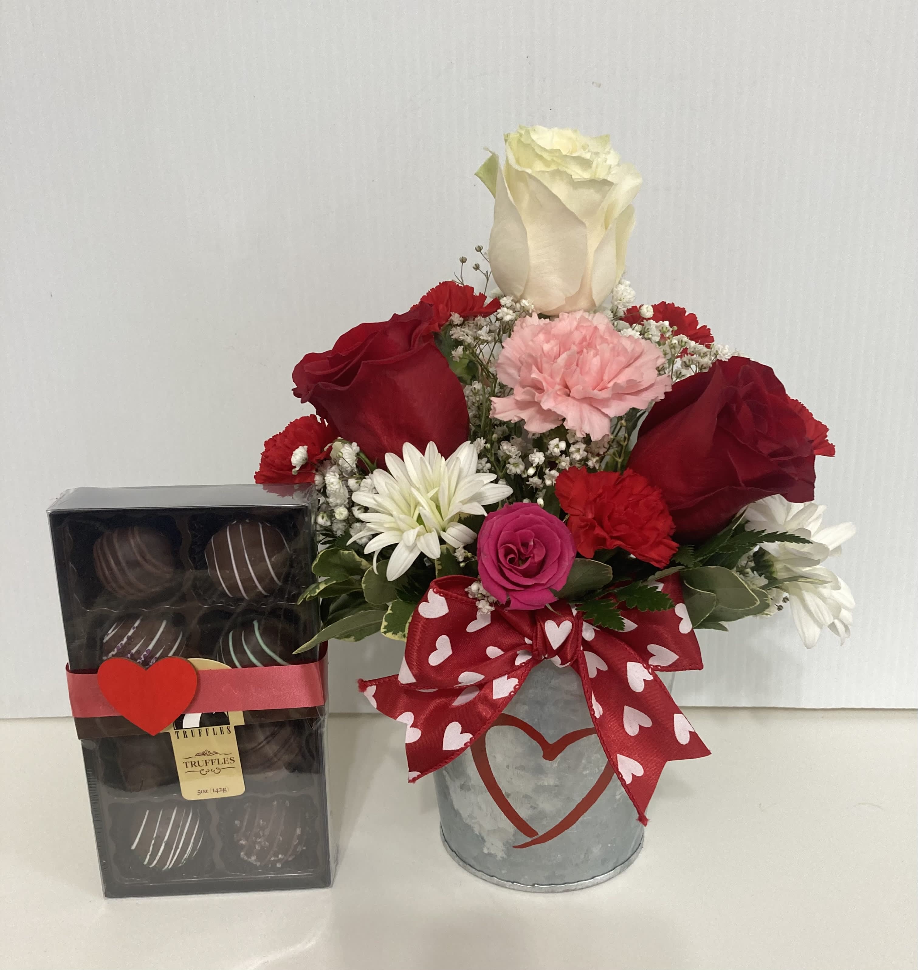 Hugs and Kisses  - Small decorative pot with roses, spray roses, daisy, carnations and greens with 8 piece delicious premium chocolates