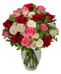 Romance of Roses  - A pretty mix of red, pink and white roses with leatherleaf designed in a clear garden vase