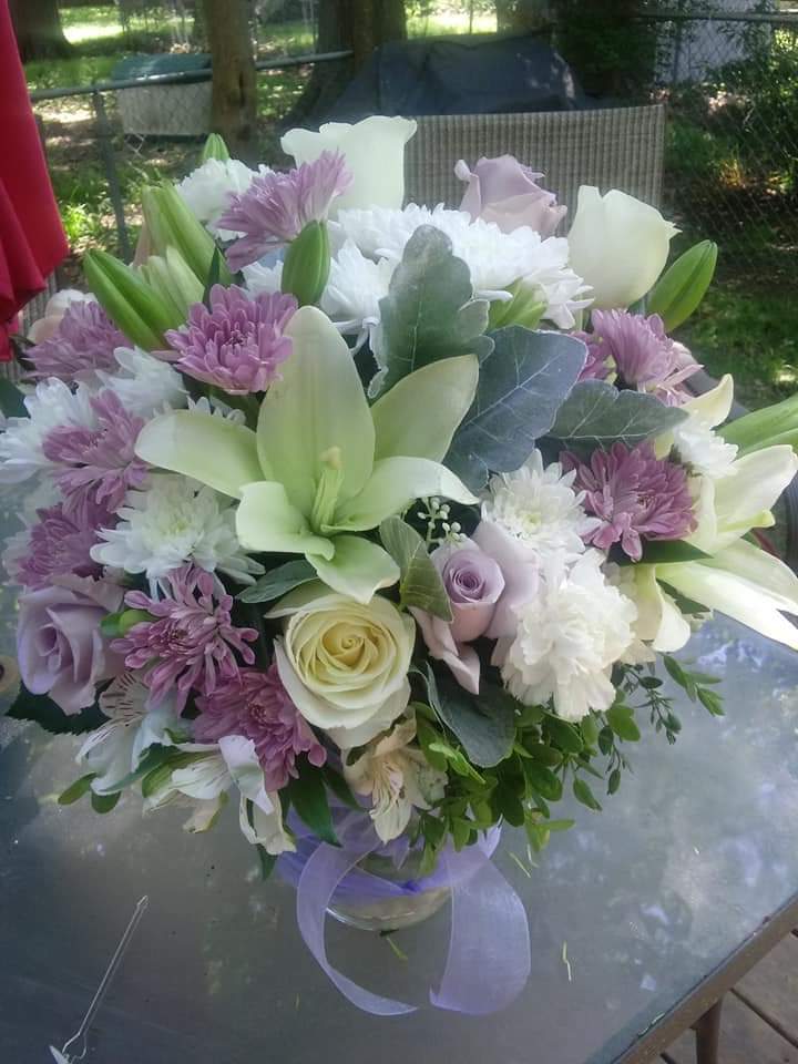 Sweet &amp; Sincere" - This is a mixture of soft subtle pastel colored blooms including lilies and roses with a good variety of filler flowers designed in a clear vase. Perfect to send to your mom for Mother's Day, birthday or just because! 